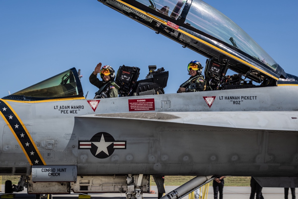 Super Hornet crew waving from the cockpit at an airshow